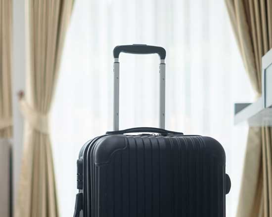 suitcase in hotel room